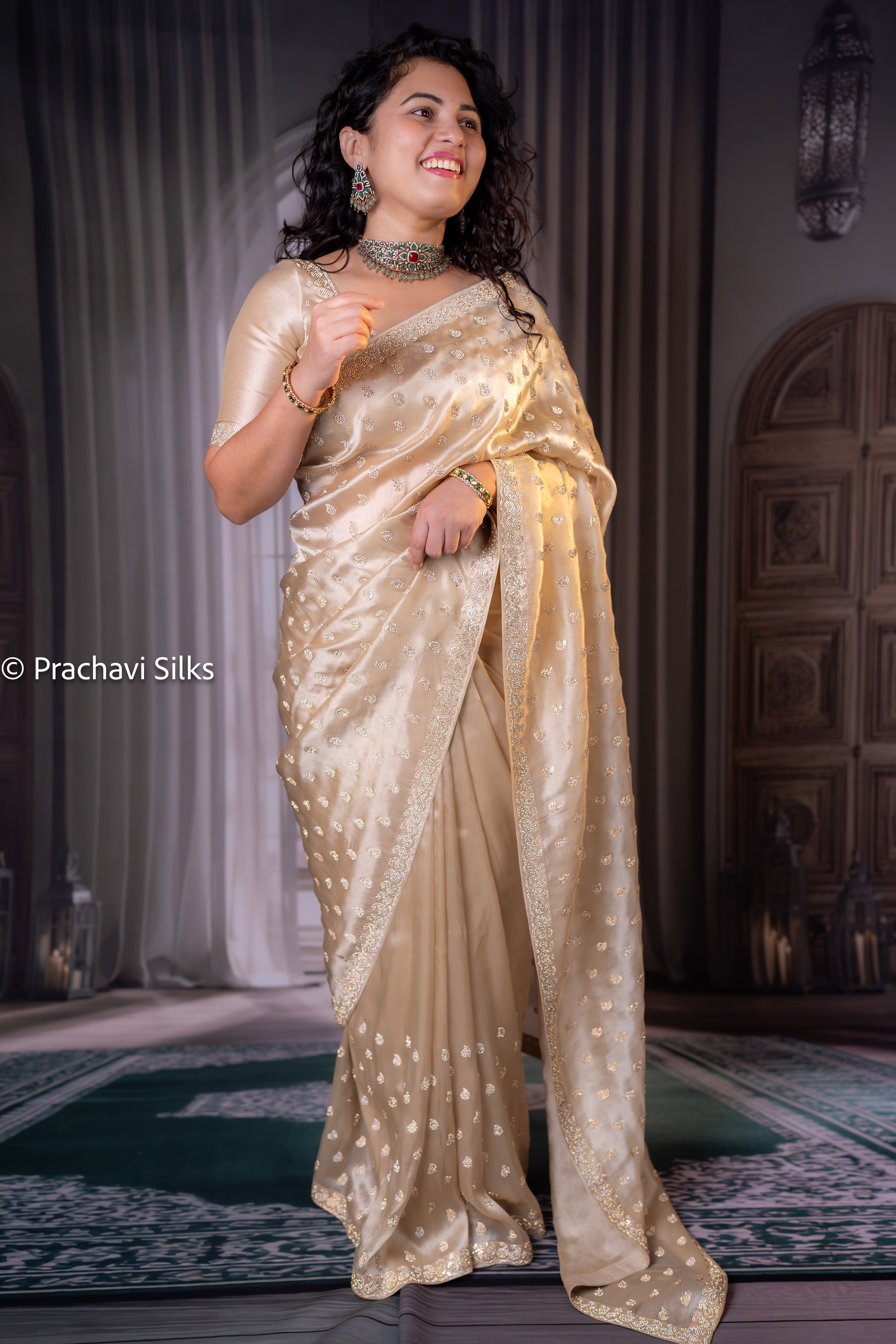 Shimmer Organza Saree in Champagne Gold with Glass Diamond Butta & Designer Border